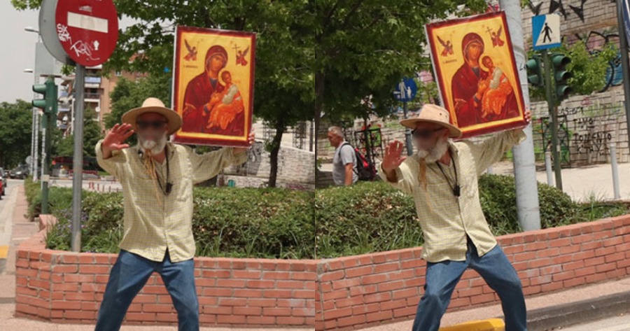 Λάρισα: Άνδρας βγήκε στους δρόμους, υψώνοντας την εικόνα της Παναγίας.